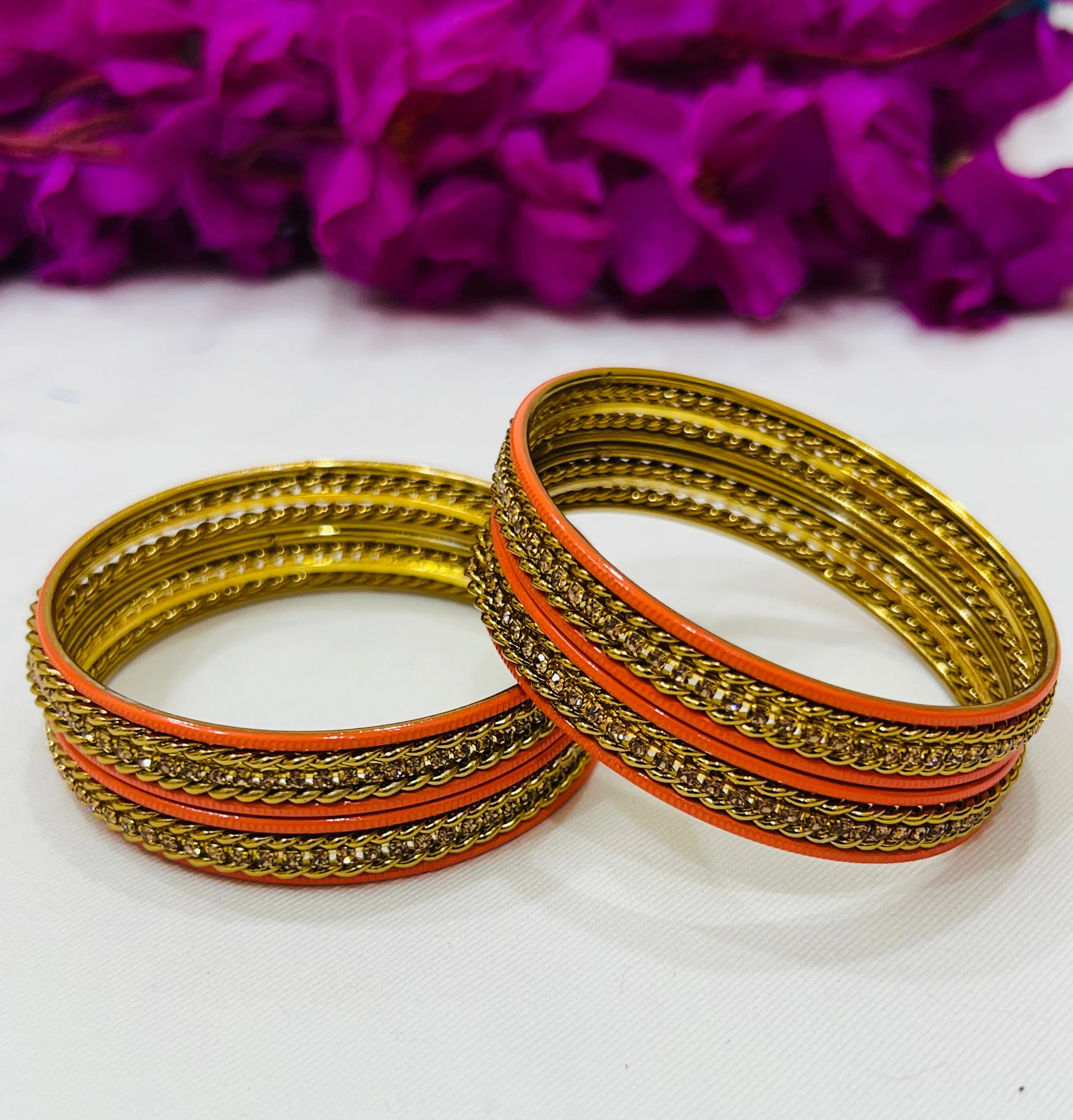 Appealing Orange Color Metal Bangles With Stone Work For Women