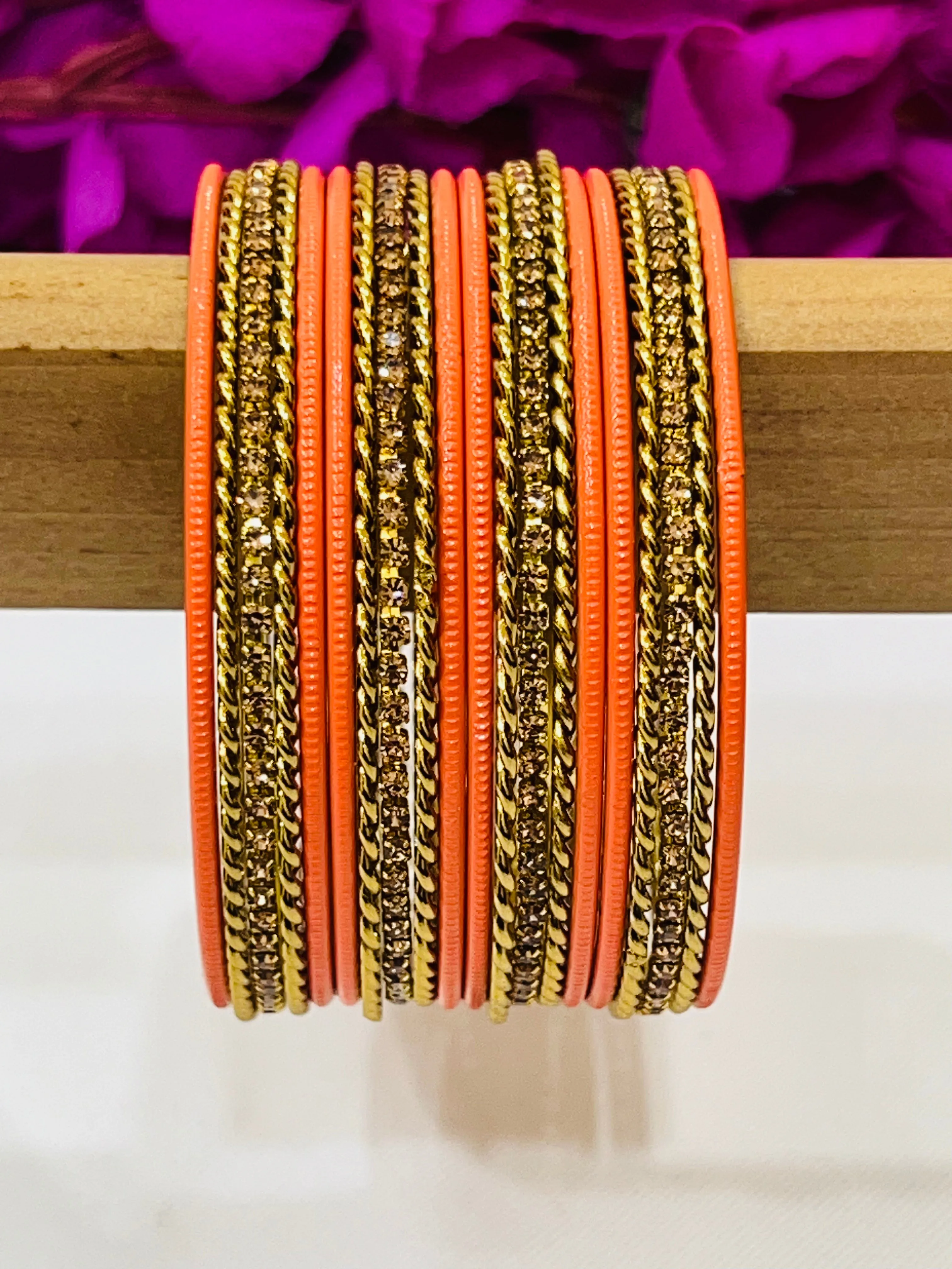 Appealing Orange Color Metal Bangles With Stone Work For Women
