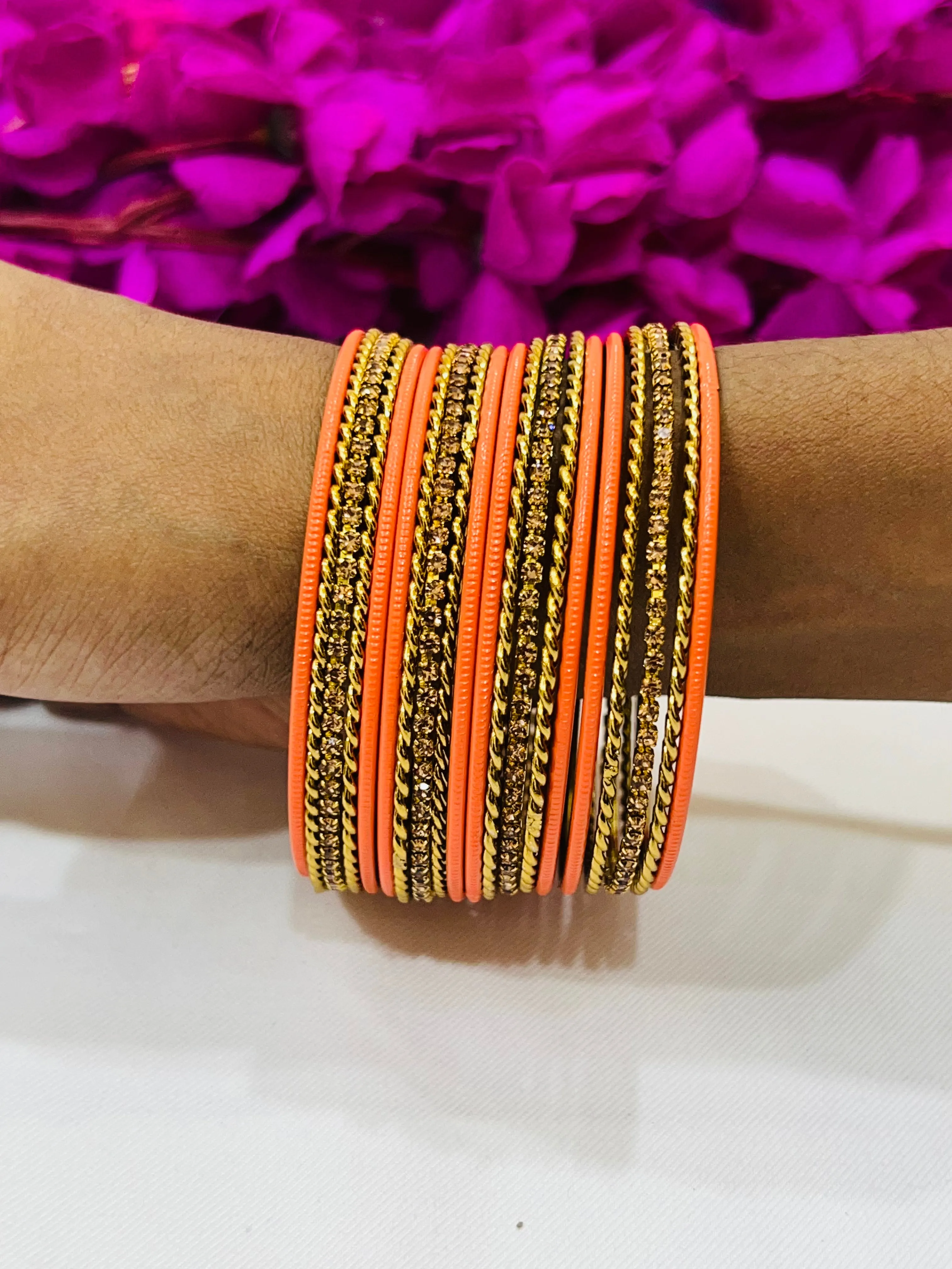 Appealing Orange Color Metal Bangles With Stone Work For Women