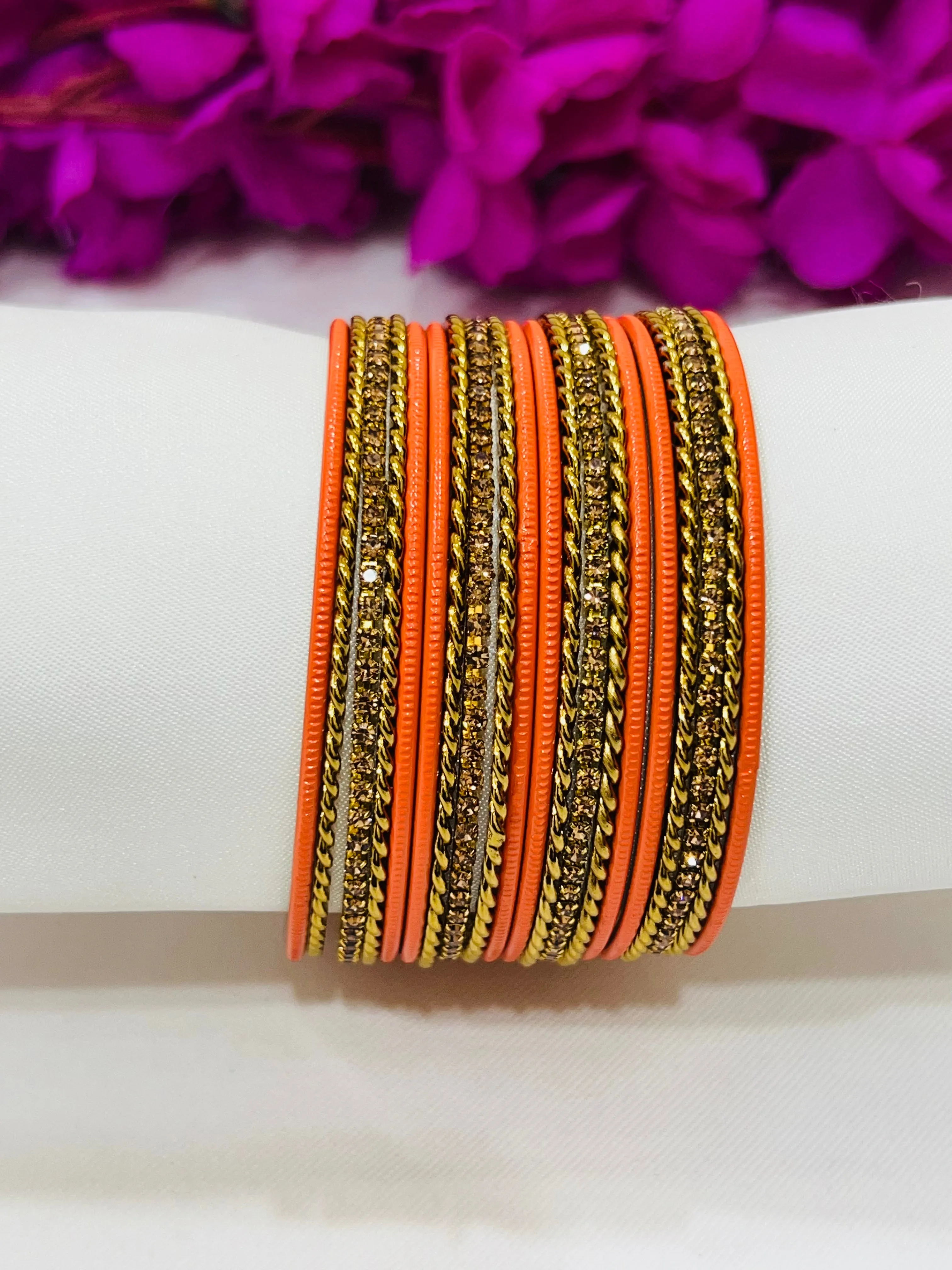 Appealing Orange Color Metal Bangles With Stone Work For Women