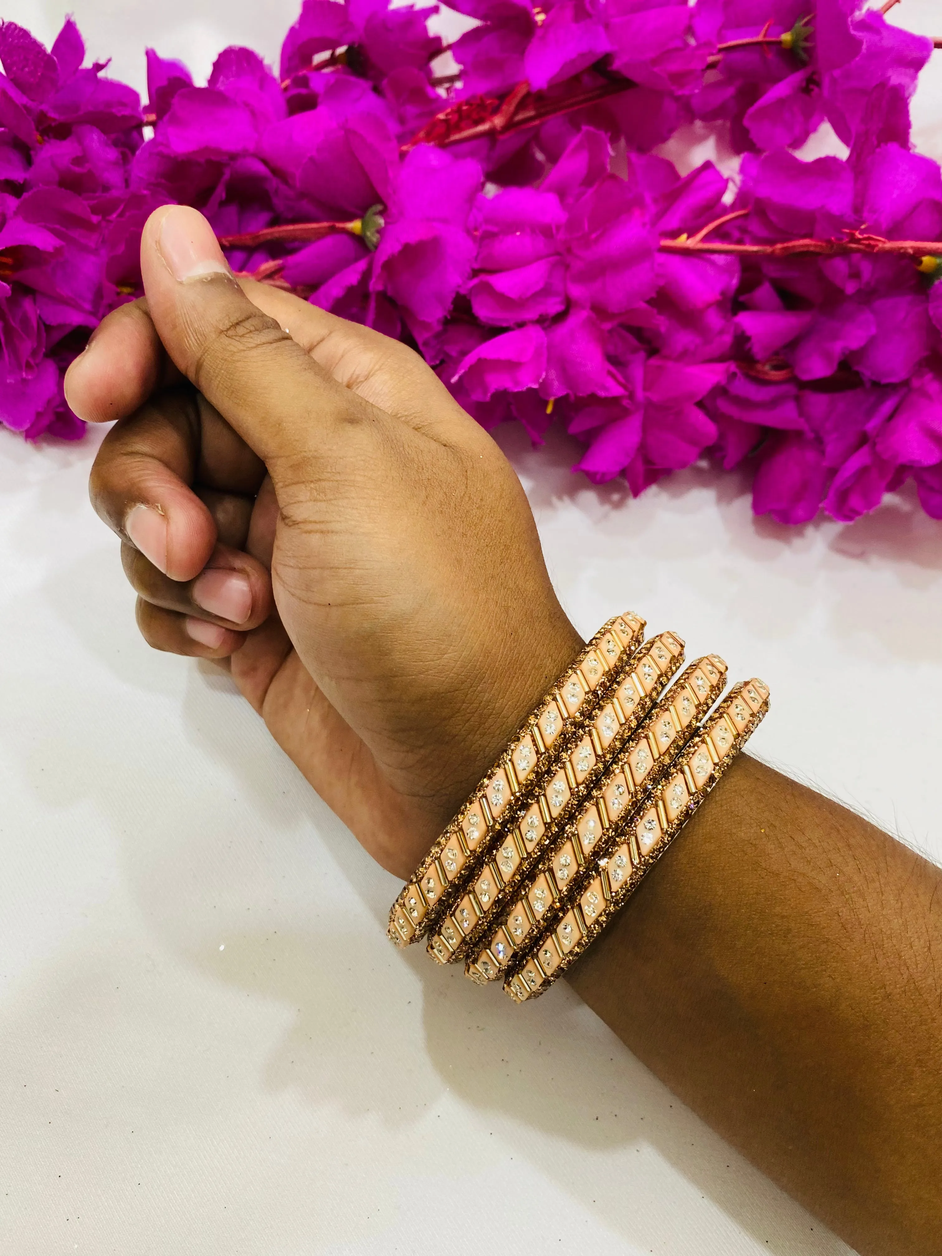 Appealing Peach Color Metal Bangles With Glitter Stone Work For Women